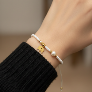 Bracelet éléphant perles blanches et dorée